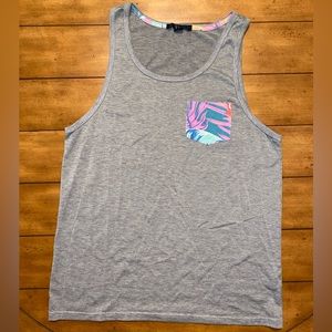 Grey men’s tank top size small, has tropical print front pocket.